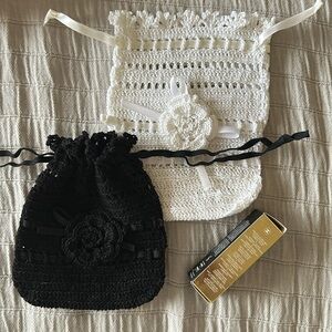 2 hand crocheted small wristlets. White 7” length and black almost 6”.